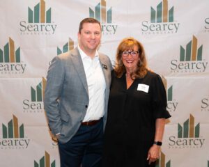 Marc Shaffer and life coach Kay Blond at a Searcy Financial event, reflecting on financial life planning.